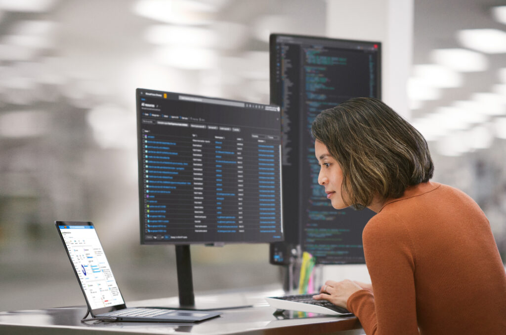 Man and woman working on a PC